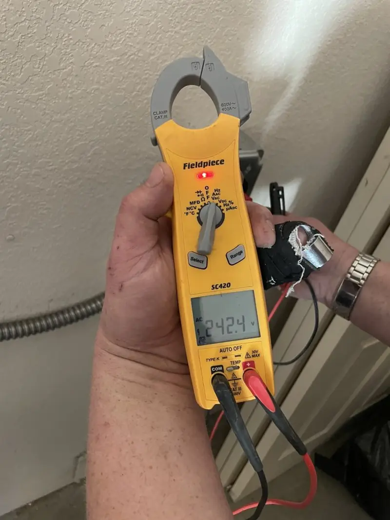 Voltage testing with clamp meter during Outlet Installation in Hornell
